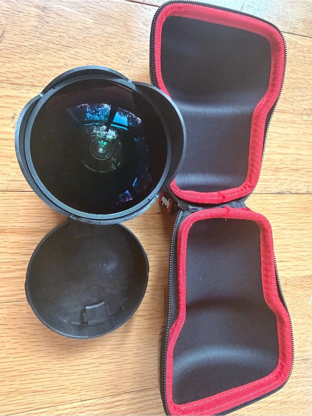 Opteka fish eye camera lens with case and camera lens organization backpack.